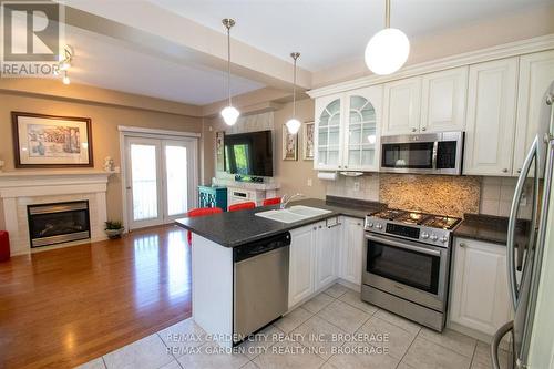421 Queenston Street, St. Catharines (E. Chester), ON - Indoor Photo Showing Kitchen With Fireplace With Stainless Steel Kitchen