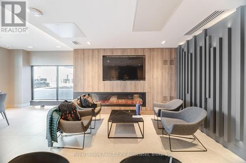 406 - 335 Wheat Boom Drive, Oakville, ON - Indoor With Fireplace