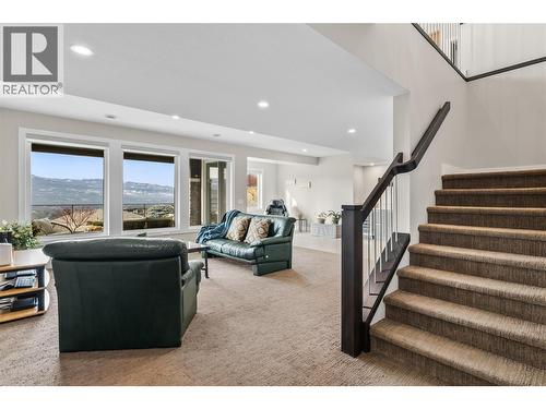 Rec room - lower level. Access to the lower level patio via the rec room. - 1376 Mine Hill Drive, Kelowna, BC - Indoor Photo Showing Other Room