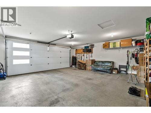 Oversized garage - 1376 Mine Hill Drive, Kelowna, BC - Indoor Photo Showing Garage