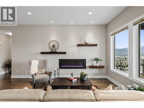 Living room - 1376 Mine Hill Drive, Kelowna, BC - Indoor Photo Showing Living Room With Fireplace