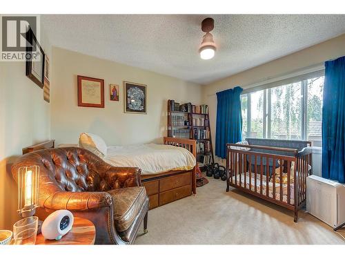 Second Bedroom, with new ceiling fan and lighting. - 983 Bernard Avenue Unit# 205, Kelowna, BC - Indoor Photo Showing Bedroom