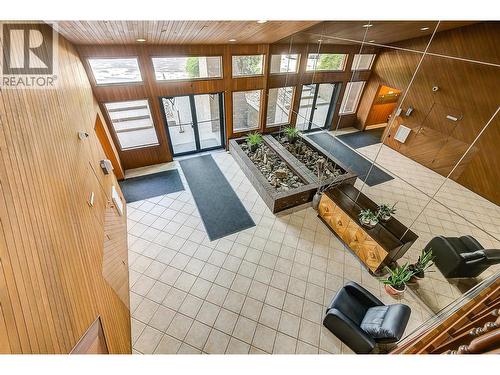 Front Lobby with wood feature walls - 983 Bernard Avenue Unit# 205, Kelowna, BC - Indoor Photo Showing Other Room