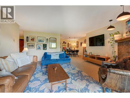 1216 square feet of livable space invites you to cozy up by the Gas Fire. - 983 Bernard Avenue Unit# 205, Kelowna, BC - Indoor Photo Showing Living Room