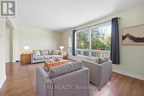 Living Room - - Virtually Staged - 302 - 2290 Cotters Crescent, Ottawa, ON - Indoor Photo Showing Living Room