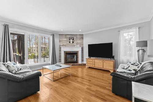 Family room - 57 Rue De La Valline, Notre-Dame-De-L'Île-Perrot, QC - Indoor Photo Showing Living Room With Fireplace
