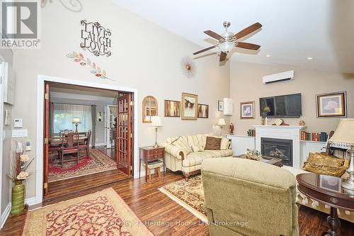 Family room with French doors & pot lights - 662 Lakeshore Road, Fort Erie (Lakeshore), ON - Indoor Photo Showing Living Room With Fireplace