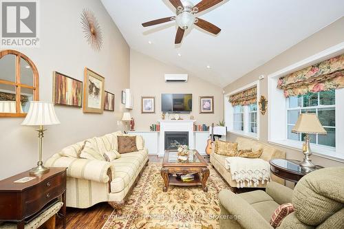 Family room with gas fireplace & vaulted ceiling - 662 Lakeshore Road, Fort Erie (Lakeshore), ON - Indoor Photo Showing Living Room With Fireplace