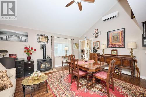 Dining area with large window and fireplace - 662 Lakeshore Road, Fort Erie (Lakeshore), ON - Indoor Photo Showing Other Room With Fireplace