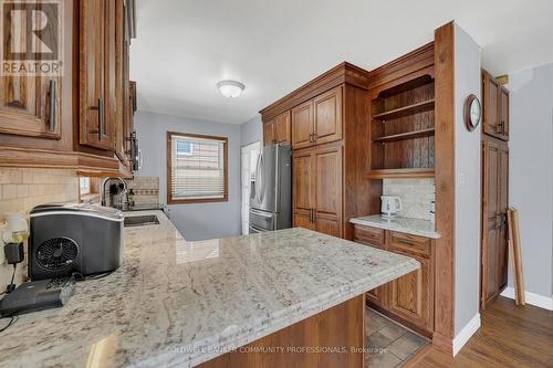 custom oak kitchen with granite tops - 446 East 36Th Street, Hamilton, ON - Indoor Photo Showing Kitchen