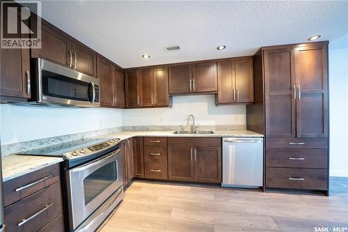 101 2300 Broad Street, Regina, SK - Indoor Photo Showing Kitchen With Double Sink