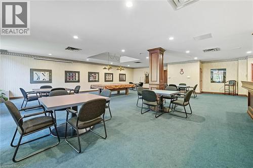 Dining space with pool table, recessed lighting, carpet floors, wooden walls, and decorative columns - 8111 Forest Glen Drive Unit# 524, Niagara Falls, ON - Indoor