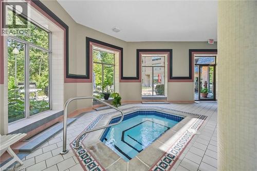 View of pool with an in-ground hot tub - 8111 Forest Glen Drive Unit# 524, Niagara Falls, ON - Indoor Photo Showing Other Room With In Ground Pool