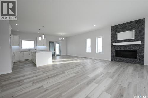 7 2330 Morsky Drive, Estevan, SK - Indoor Photo Showing Living Room With Fireplace