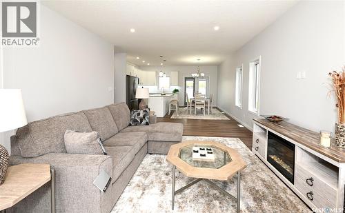 3 2330 Morsky Drive, Estevan, SK - Indoor Photo Showing Living Room With Fireplace