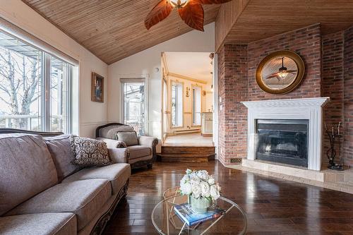 Family room - 8940 Boul. Marie-Victorin, Brossard, QC - Indoor Photo Showing Living Room With Fireplace