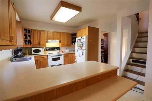 113 7 Highway S, Teulon, MB - Indoor Photo Showing Kitchen With Double Sink