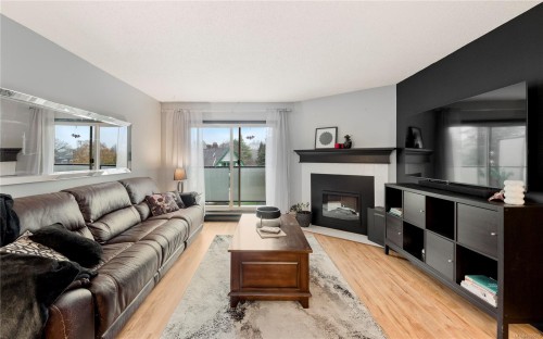 402-1241 Fairfield Rd, Victoria, BC - Indoor Photo Showing Living Room With Fireplace