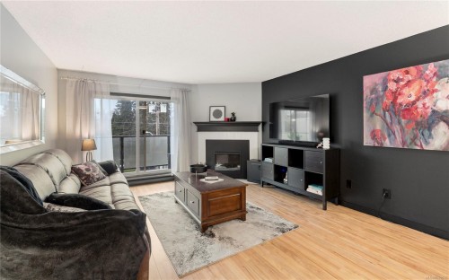 402-1241 Fairfield Rd, Victoria, BC - Indoor Photo Showing Living Room With Fireplace
