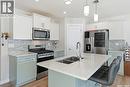 458 Schmeiser Bend, Saskatoon, SK  - Indoor Photo Showing Kitchen With Stainless Steel Kitchen With Double Sink With Upgraded Kitchen 