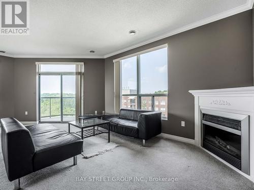 606 - 255 Keats Way, Waterloo, ON - Indoor Photo Showing Living Room With Fireplace