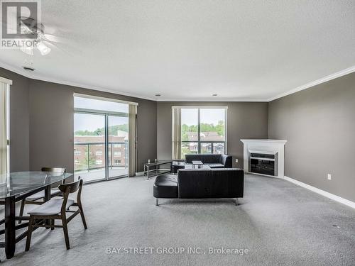 606 - 255 Keats Way, Waterloo, ON - Indoor Photo Showing Other Room With Fireplace