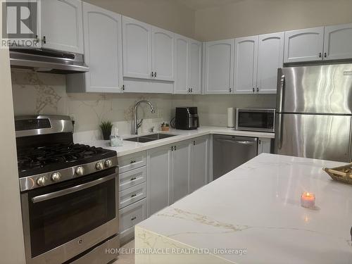 17 - 7385 Magistrate Terrace, Mississauga, ON - Indoor Photo Showing Kitchen With Double Sink