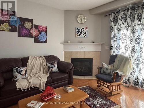 17 - 7385 Magistrate Terrace, Mississauga, ON - Indoor Photo Showing Living Room With Fireplace