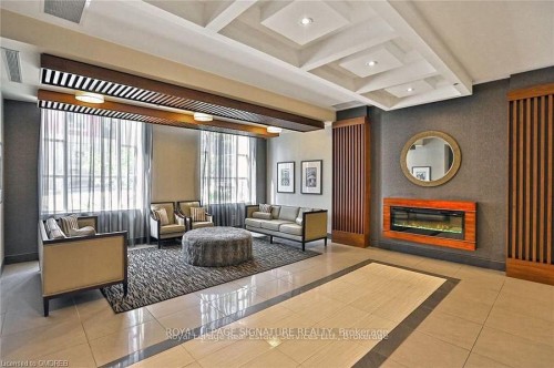 614-150 Main Street W, Hamilton, ON - Indoor With Fireplace