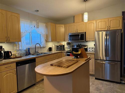 1516 3Rd Street S, Swan River, MB - Indoor Photo Showing Kitchen With Stainless Steel Kitchen With Double Sink