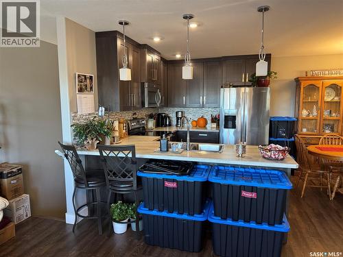 4 110 Centennial Boulevard, Warman, SK - Indoor Photo Showing Kitchen With Stainless Steel Kitchen With Double Sink With Upgraded Kitchen