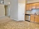 112 302 Bemister Avenue E, Melfort, SK  - Indoor Photo Showing Kitchen With Double Sink 