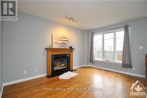 135 Stoneway Drive, Ottawa, ON - Indoor Photo Showing Living Room With Fireplace