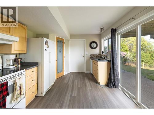 New flooring - 5826 Bartlett Road, Vernon, BC - Indoor Photo Showing Kitchen