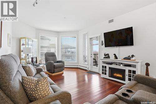 207 615 Saskatchewan Crescent W, Saskatoon, SK - Indoor Photo Showing Living Room With Fireplace