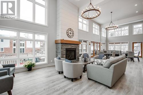 Common room - 301 - 200 Anglo Street, Bracebridge (Macaulay), ON - Indoor Photo Showing Living Room With Fireplace