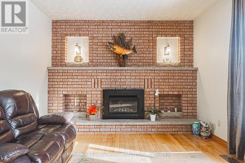 19 Hadeland Avenue, Hamilton, ON - Indoor Photo Showing Living Room With Fireplace