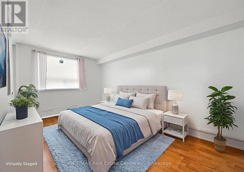 Primary Bedroom Virtually Staged - 310 - 65 Silvercreek Parkway N, Guelph (Junction/Onward Willow), ON - Indoor Photo Showing Bedroom