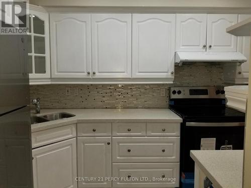 94 - 923 Burns Street W, Whitby, ON - Indoor Photo Showing Kitchen With Double Sink