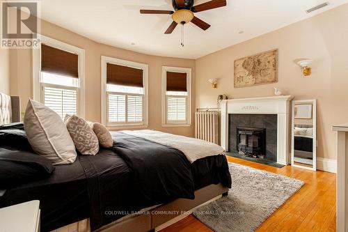 34 Holton Avenue S, Hamilton, ON - Indoor Photo Showing Bedroom With Fireplace