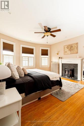 34 Holton Avenue S, Hamilton, ON - Indoor Photo Showing Bedroom With Fireplace
