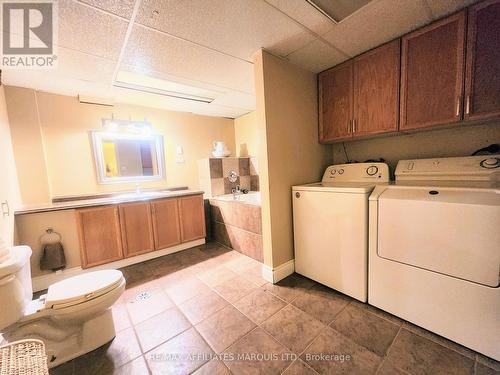 Bathroom with Jetted tub and Laundry - 428 Bellevue Crescent, Cornwall, ON - Indoor Photo Showing Laundry Room