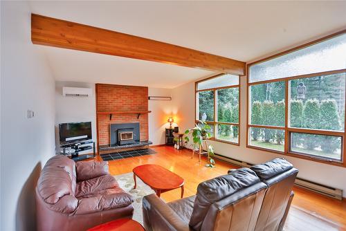 1438 Nichol Road, Revelstoke, BC - Indoor Photo Showing Living Room With Fireplace