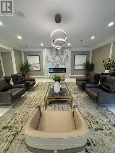 306 - 75 King Street E, Mississauga, ON - Indoor Photo Showing Living Room With Fireplace