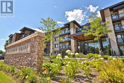 103 - 128 Garden Drive, Oakville, ON - Outdoor With Facade