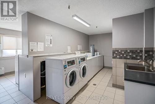 Coin-op laundry - 421 - 198 Scott Street, St. Catharines (Fairview), ON - Indoor Photo Showing Laundry Room