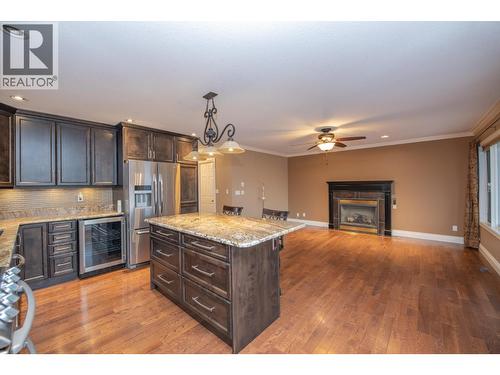 7903 Lakeview Drive, Coldstream, BC - Indoor Photo Showing Kitchen With Fireplace With Upgraded Kitchen