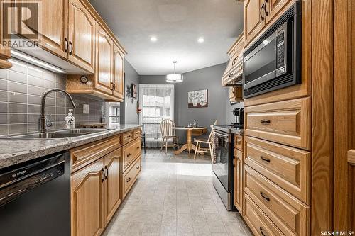 309 2305 Adelaide Street E, Saskatoon, SK - Indoor Photo Showing Kitchen With Double Sink