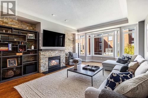 56 Kings Landing Private, Ottawa, ON - Indoor Photo Showing Living Room With Fireplace