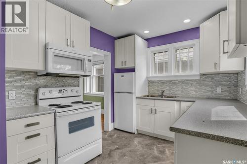 107 28Th Street W, Saskatoon, SK - Indoor Photo Showing Kitchen With Double Sink